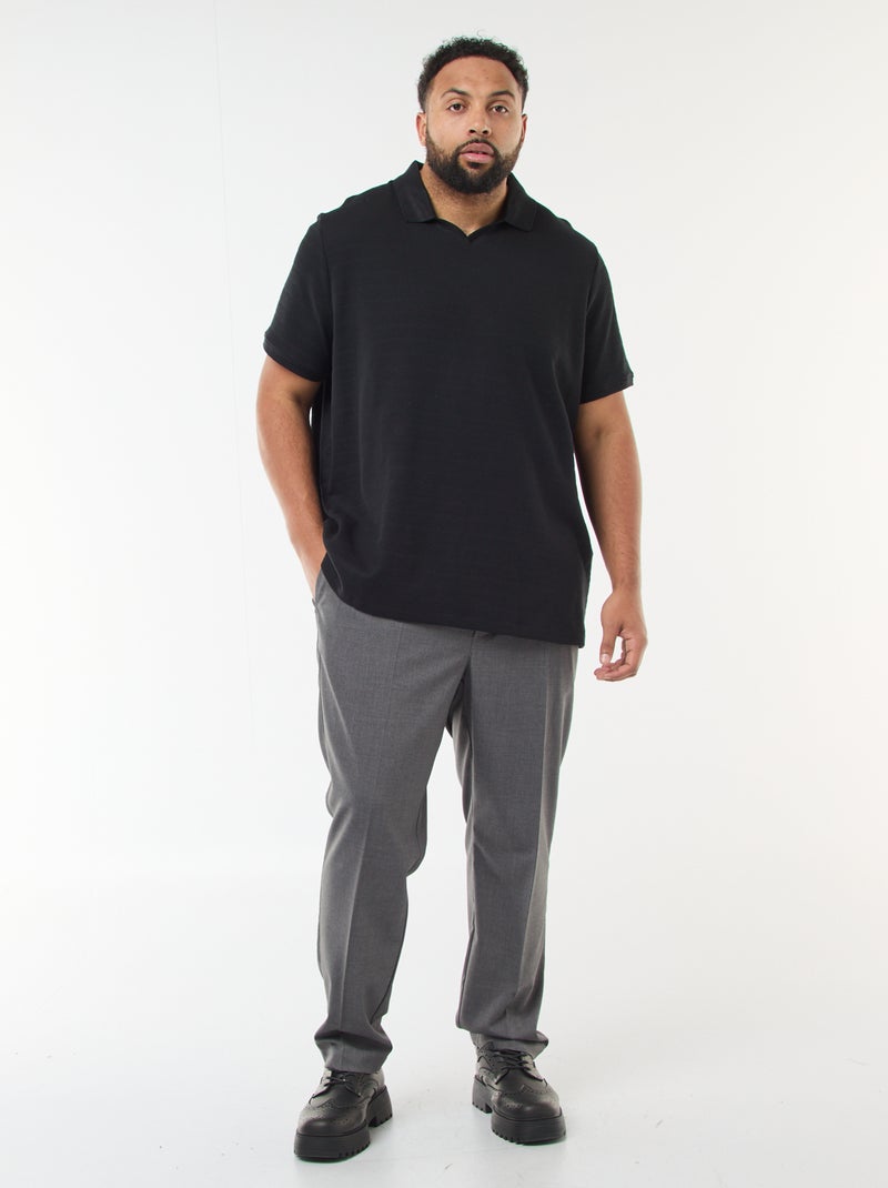 Polo in cotone stretch a maniche corte Nero - Kiabi
