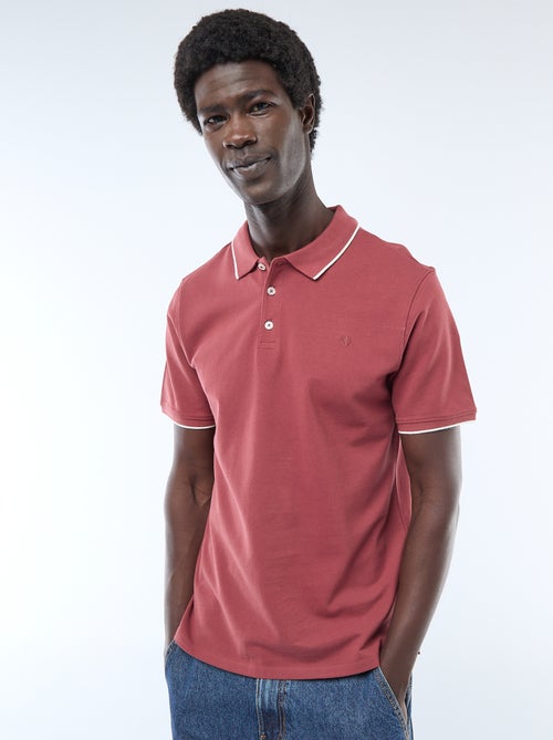 Polo in cotone tinta unita da uomo con colletto classico - Kiabi Polo in cotone tinta unita da uomo con colletto classico - Kiabi