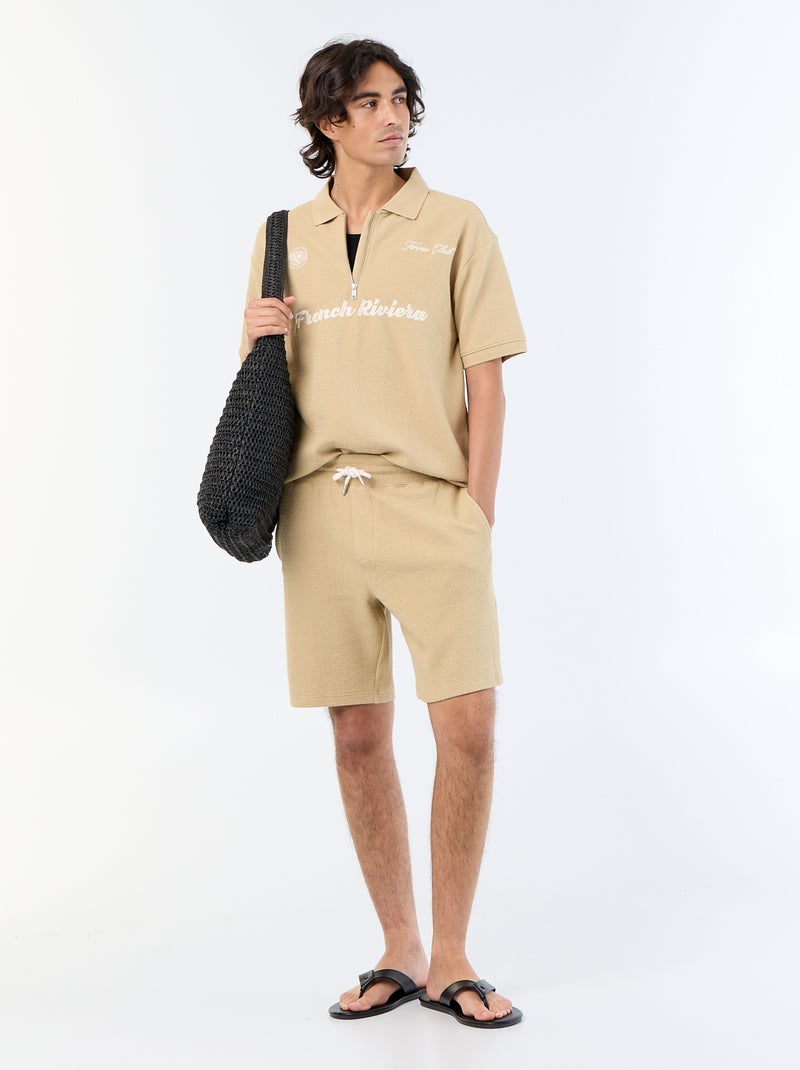 Polo in tessuto fantasia a maniche corte Beige - Kiabi