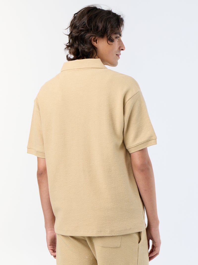 Polo in tessuto fantasia a maniche corte Beige - Kiabi