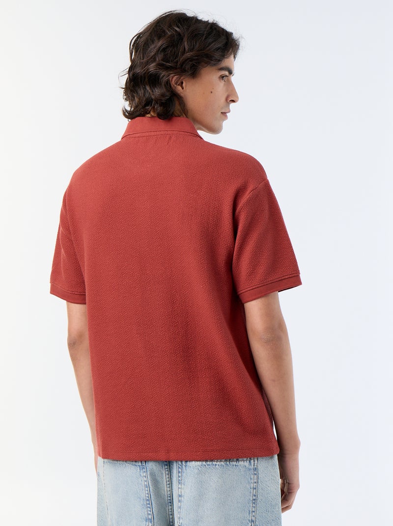 Polo in tessuto fantasia a maniche corte Rosso - Kiabi