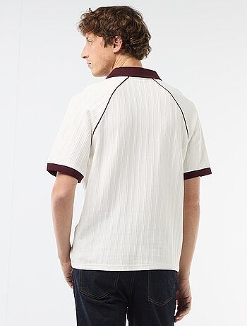 Polo in tessuto fantasia con collo polo senza bottoni