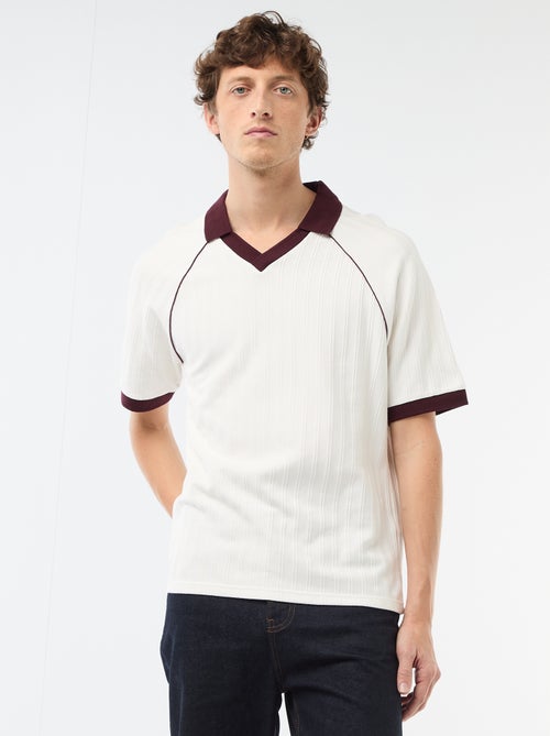 Polo in tessuto fantasia con collo polo senza bottoni - Kiabi Polo in tessuto fantasia con collo polo senza bottoni - Kiabi