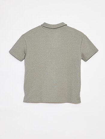 Polo loose fit con tasca