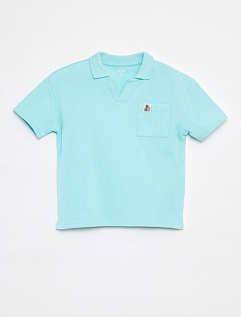 Polo loose fit con tasca