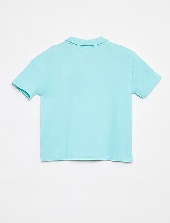 Polo loose fit con tasca