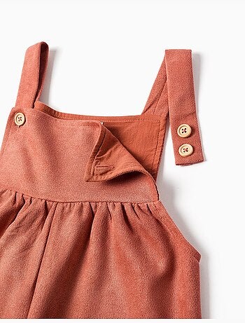 Salopette a gamba larga in maglia interlock con tasche
