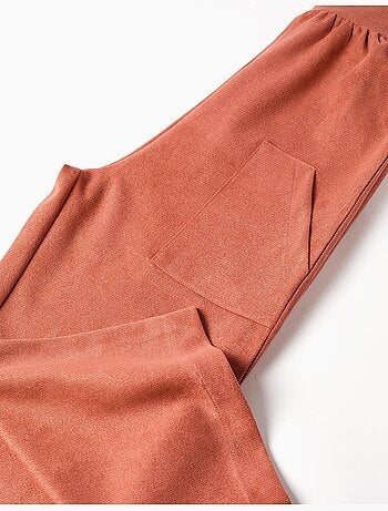 Salopette a gamba larga in maglia interlock con tasche