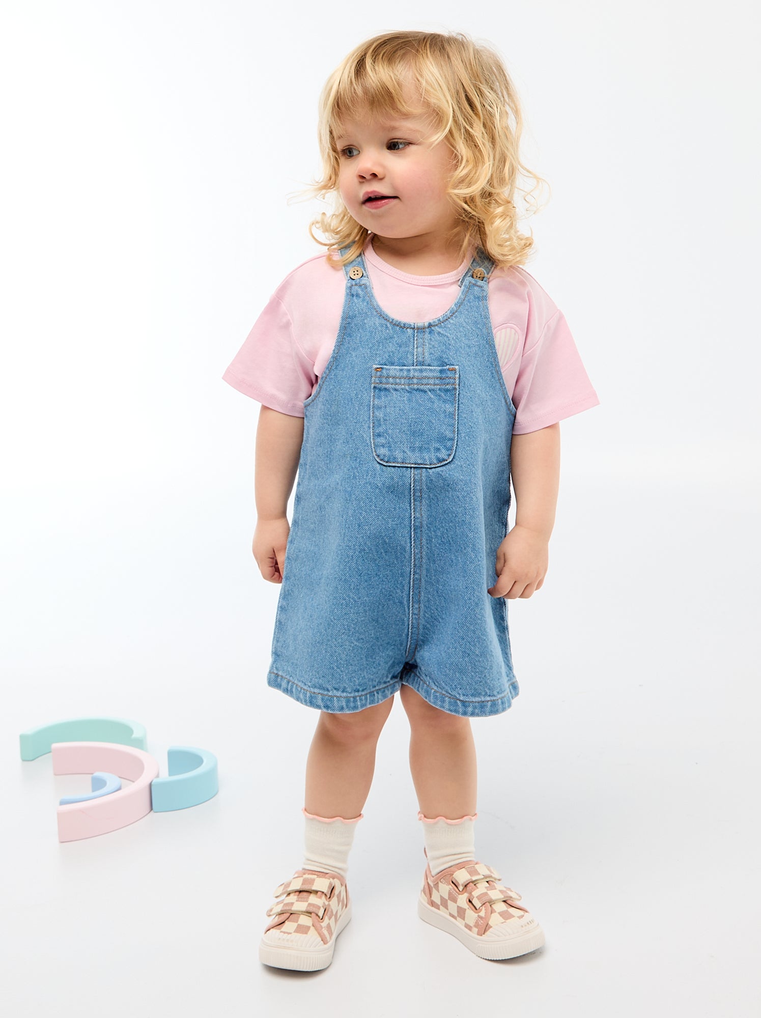 Salopette corta con tasca sul petto