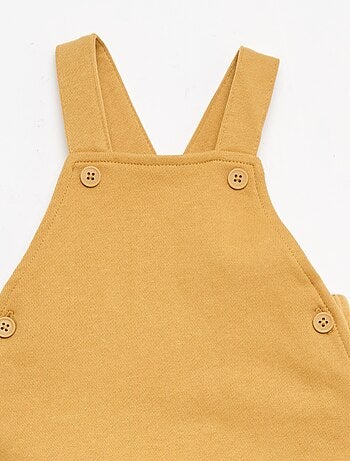 Salopette corta in french terry con bretelle in cotone