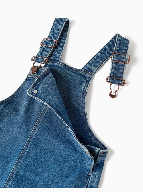 Salopette in denim a a gamba larga con orli sfrangiati - Kiabi