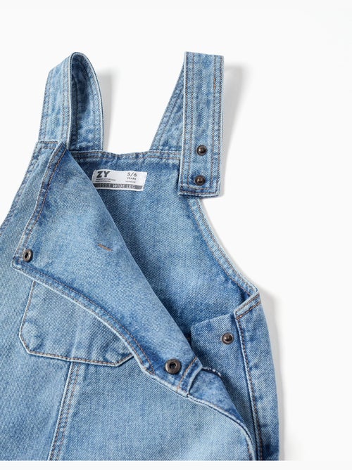 Salopette in denim a a gamba larga con orli sfrangiati - Kiabi