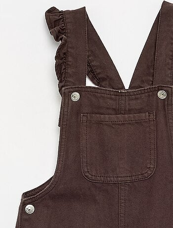 Salopette lunga in denim con bretelle a balze