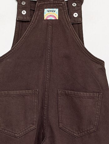 Salopette lunga in denim con bretelle a balze