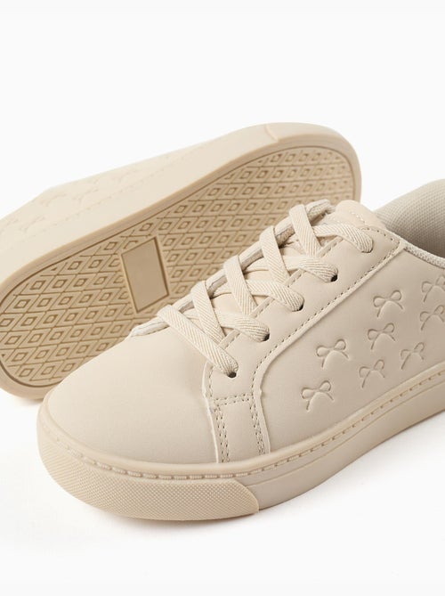 Scarpe da ginnastica con fiocchi in rilievo e lacci elastici - Kiabi Scarpe da ginnastica con fiocchi in rilievo e lacci elastici - Kiabi