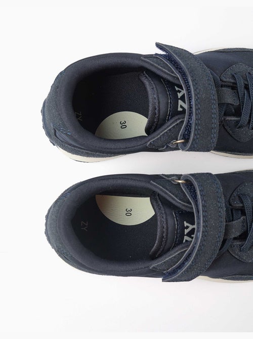 Scarpe da ginnastica in doppio tessuto con suola antiscivolo - Kiabi Scarpe da ginnastica in doppio tessuto con suola antiscivolo - Kiabi