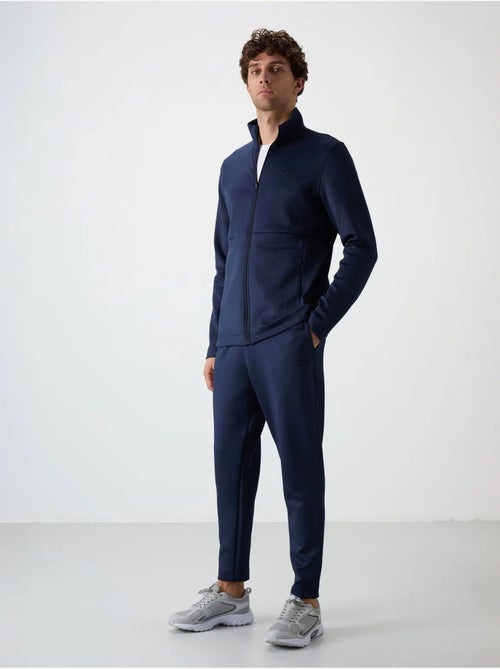 Set active da uomo in scuba di poliestere con collo con zip tommy - Kiabi Set active da uomo in scuba di poliestere con collo con zip tommy - Kiabi