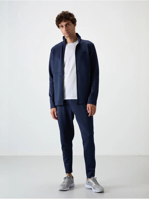 Set active da uomo in scuba di poliestere con collo con zip tommy - Kiabi Set active da uomo in scuba di poliestere con collo con zip tommy - Kiabi