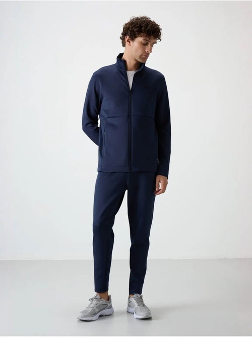 Set active da uomo in scuba di poliestere con collo con zip tommy - Kiabi Set active da uomo in scuba di poliestere con collo con zip tommy - Kiabi