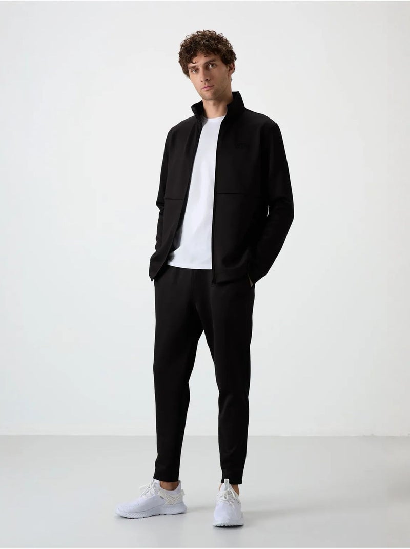 Set active da uomo in scuba di poliestere con collo con zip tommy Nero - Kiabi