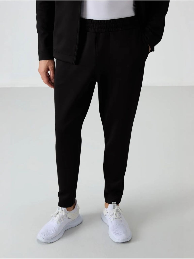 Set active da uomo in scuba di poliestere con collo con zip tommy Nero - Kiabi