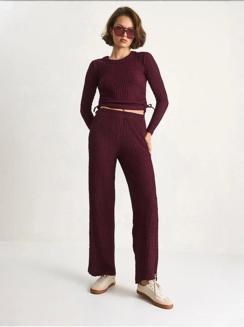 Set co-ord a due pezzi aderente con pantaloni a zampa lucci - Kiabi Set co-ord a due pezzi aderente con pantaloni a zampa lucci - Kiabi