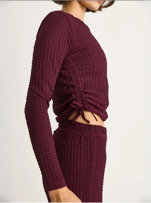 Set co-ord a due pezzi aderente con pantaloni a zampa lucci - Kiabi Set co-ord a due pezzi aderente con pantaloni a zampa lucci - Kiabi