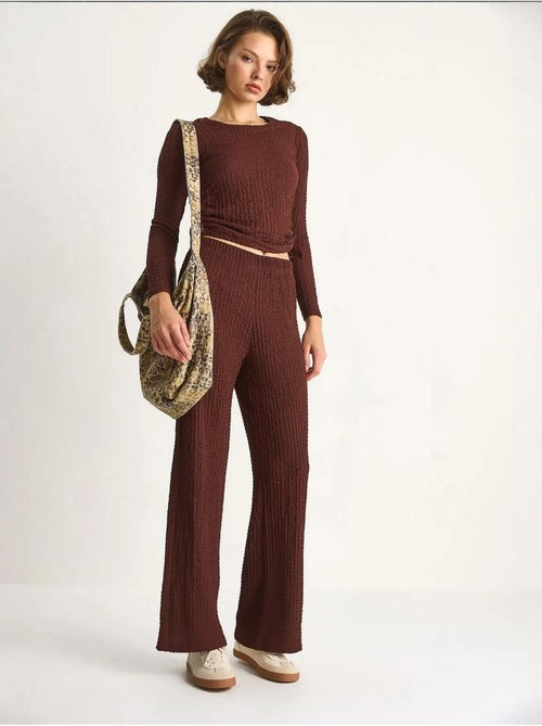 Set co-ord a due pezzi aderente con pantaloni a zampa lucci - Kiabi Set co-ord a due pezzi aderente con pantaloni a zampa lucci - Kiabi