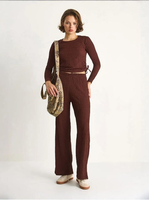 Set co-ord a due pezzi aderente con pantaloni a zampa lucci - Kiabi Set co-ord a due pezzi aderente con pantaloni a zampa lucci - Kiabi