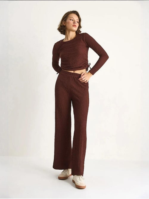 Set co-ord a due pezzi aderente con pantaloni a zampa lucci - Kiabi Set co-ord a due pezzi aderente con pantaloni a zampa lucci - Kiabi
