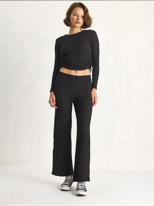 Set co-ord a due pezzi aderente con pantaloni a zampa lucci - Kiabi Set co-ord a due pezzi aderente con pantaloni a zampa lucci - Kiabi