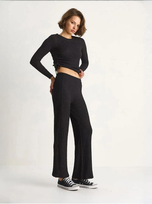 Set co-ord a due pezzi aderente con pantaloni a zampa lucci - Kiabi Set co-ord a due pezzi aderente con pantaloni a zampa lucci - Kiabi