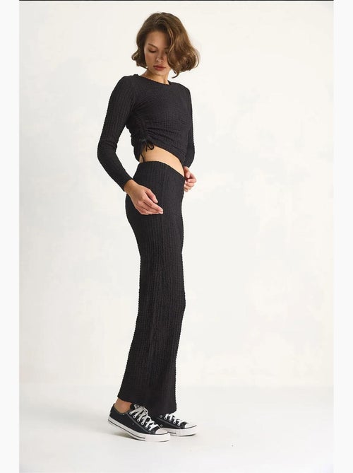 Set co-ord a due pezzi aderente con pantaloni a zampa lucci - Kiabi Set co-ord a due pezzi aderente con pantaloni a zampa lucci - Kiabi