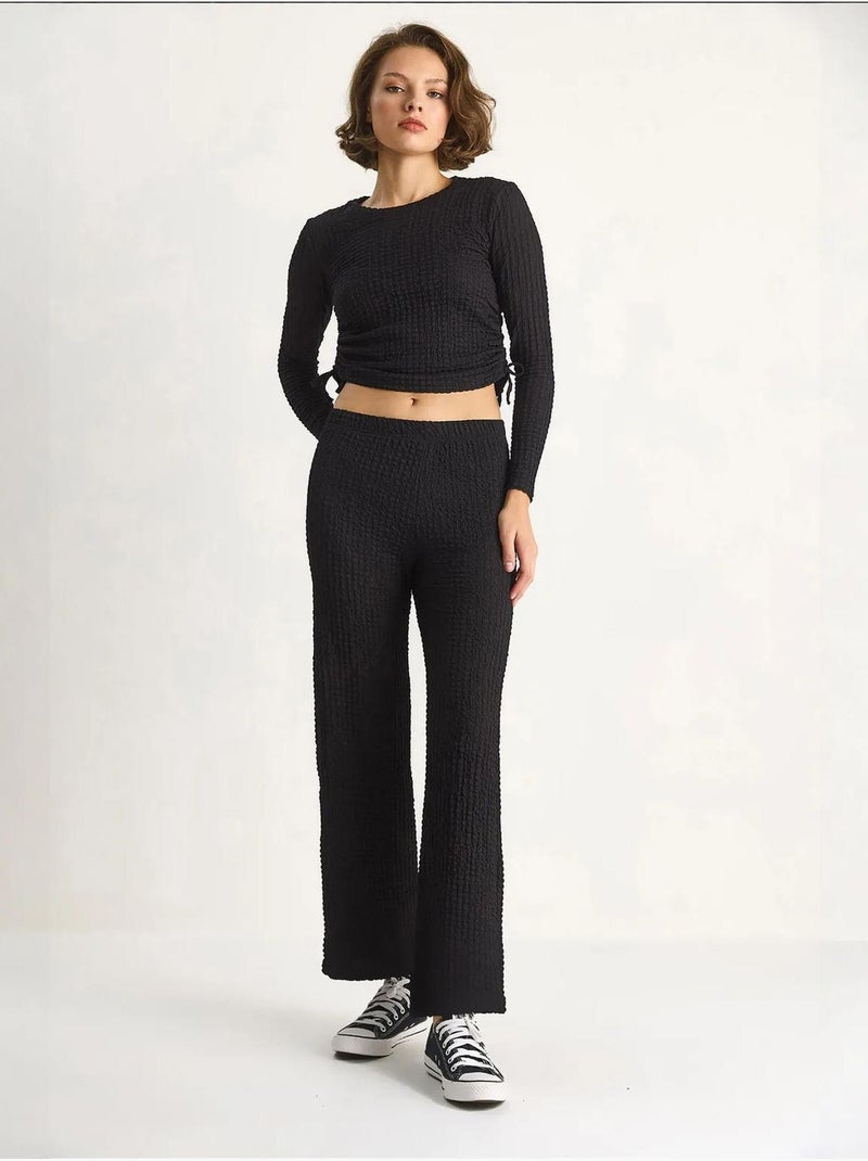 Set co-ord a due pezzi aderente con pantaloni a zampa lucci Nero - Kiabi