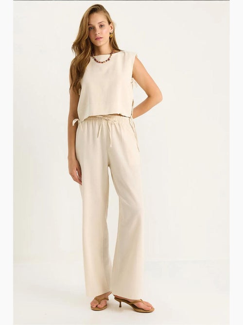 Set co-ord a due pezzi con girocollo, chiusura con laccetti e pantaloni a gamba ampia lucci - Kiabi Set co-ord a due pezzi con girocollo, chiusura con laccetti e pantaloni a gamba ampia lucci - Kiabi