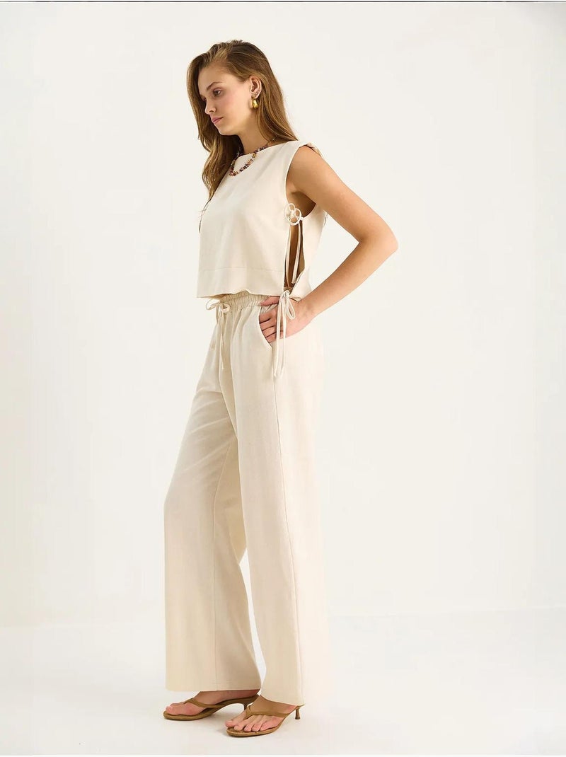 Set co-ord a due pezzi con girocollo, chiusura con laccetti e pantaloni a gamba ampia lucci Beige argilla - Kiabi