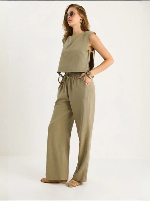 Set co-ord a due pezzi con girocollo, chiusura con laccetti e pantaloni a gamba ampia lucci - Kiabi Set co-ord a due pezzi con girocollo, chiusura con laccetti e pantaloni a gamba ampia lucci - Kiabi
