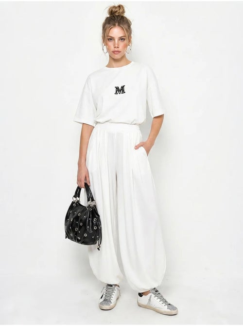 Set con t-shirt oversize a girocollo e pantaloni a gamba ampia lucci - Kiabi Set con t-shirt oversize a girocollo e pantaloni a gamba ampia lucci - Kiabi