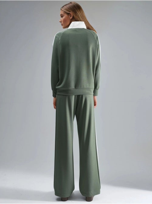 Set coordinato a due pezzi a righe con pantaloni a gamba ampia e colletto con zip hiccup - Kiabi Set coordinato a due pezzi a righe con pantaloni a gamba ampia e colletto con zip hiccup - Kiabi