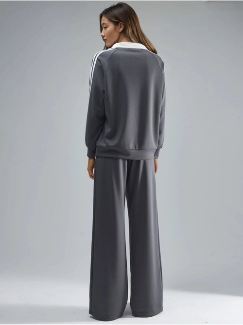 Set coordinato a due pezzi a righe con pantaloni a gamba ampia e colletto con zip hiccup - Kiabi Set coordinato a due pezzi a righe con pantaloni a gamba ampia e colletto con zip hiccup - Kiabi
