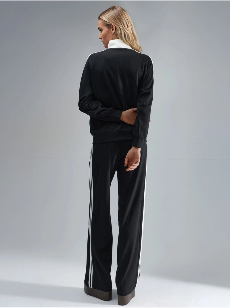 Set coordinato a due pezzi a righe con pantaloni a gamba ampia e colletto con zip hiccup Nero - Kiabi
