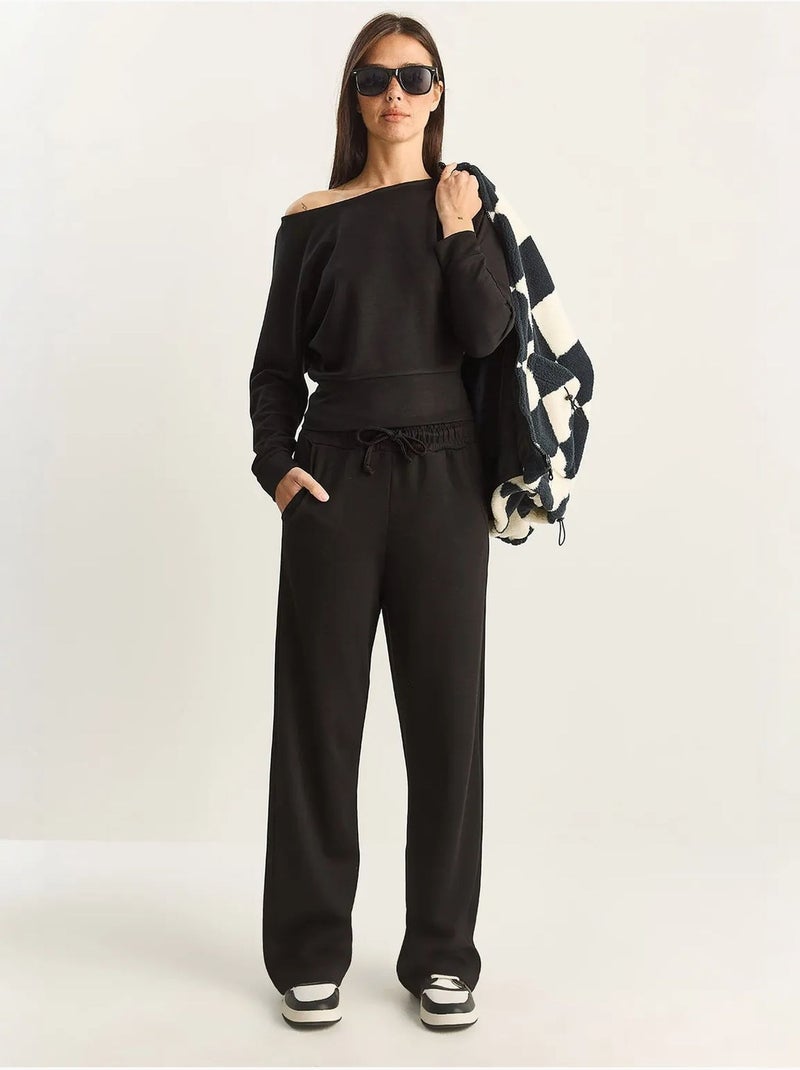Set coordinato a due pezzi in maglia con colletto asimmetrico e vita alta lucci Nero - Kiabi