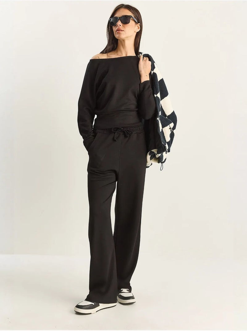Set coordinato a due pezzi in maglia con colletto asimmetrico e vita alta lucci Nero - Kiabi