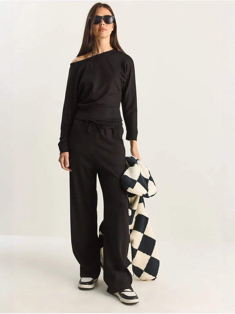 Set coordinato a due pezzi in maglia con colletto asimmetrico e vita alta lucci Nero - Kiabi