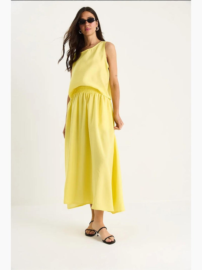 Set coordinato con top senza maniche a scollo rotondo e gonna midi lucci Giallo limone - Kiabi