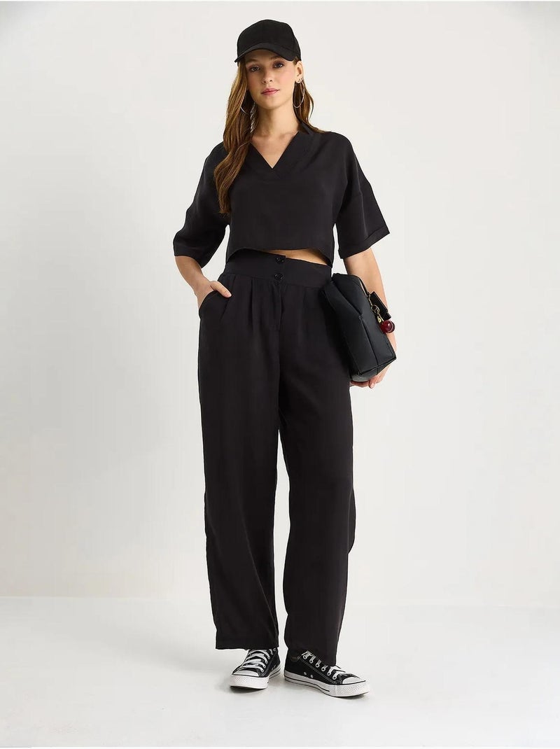 Set coordinato in maglia a due pezzi con scollo a v e pantaloni a gamba ampia lucci Nero - Kiabi