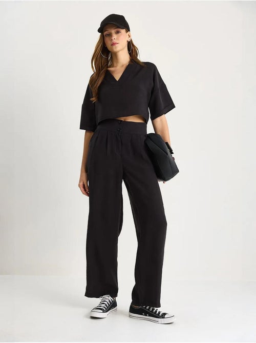 Set coordinato in maglia a due pezzi con scollo a v e pantaloni a gamba ampia lucci - Kiabi