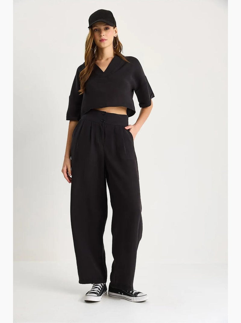 Set coordinato in maglia a due pezzi con scollo a v e pantaloni a gamba ampia lucci Nero - Kiabi
