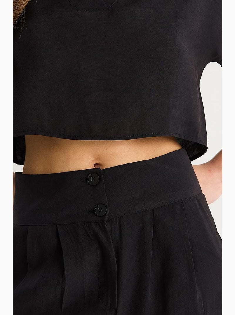 Set coordinato in maglia a due pezzi con scollo a v e pantaloni a gamba ampia lucci Nero - Kiabi