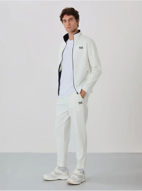 Set da uomo con felpa con collo con zip e pantaloni tommy - Kiabi Set da uomo con felpa con collo con zip e pantaloni tommy - Kiabi